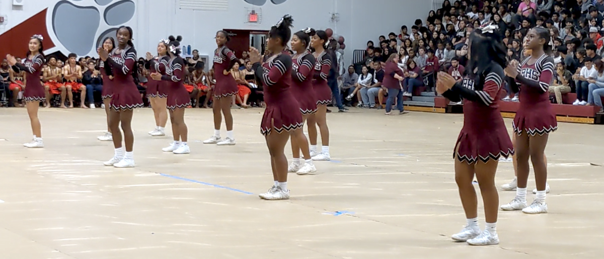 Cougarettes in fashion Cheering at the Cougars Rising Assembly
