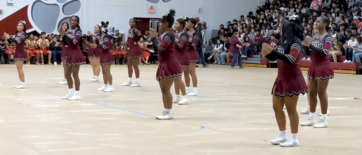 Cougarettes in fashion Cheering at the Cougar's Rising Assembly
